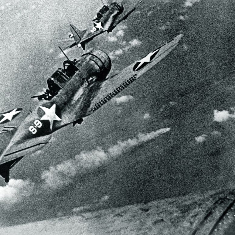 SBD-3_Dauntless_bombers_of_VS-8_over_the_burning_Japanese_cruiser_Miku