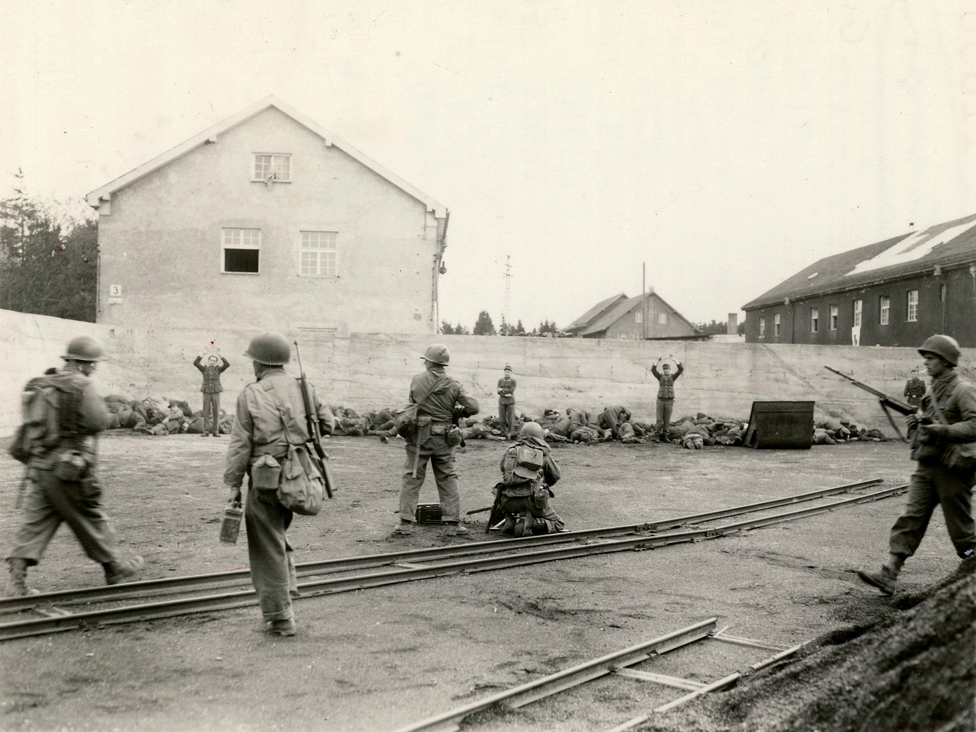 1920px-Dachau_execution_coalyard_1945-04-29
